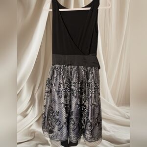 SLNY black and silver cocktail dress, Size 10 featuring a plunging neckline